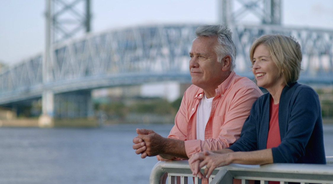 couple overlooking river