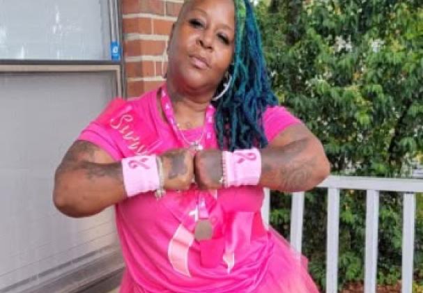 Lisette Davila wears pink as a breast cancer survivor thanking the doctors and staff at the UF Health Proton Therapy Institute