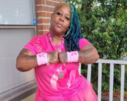 Lisette Davila wears pink as a breast cancer survivor thanking the doctors and staff at the UF Health Proton Therapy Institute