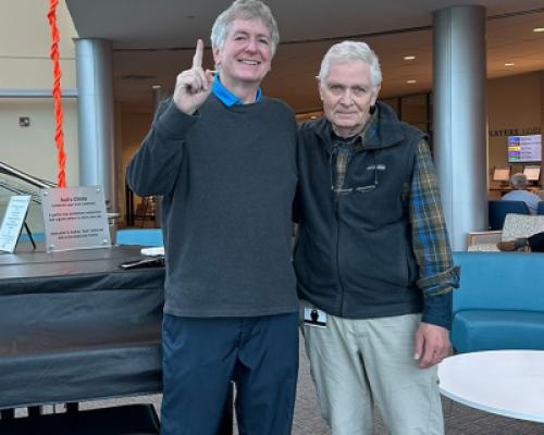 Prostate cancer survivor Michael D. and friend at chime ceremony